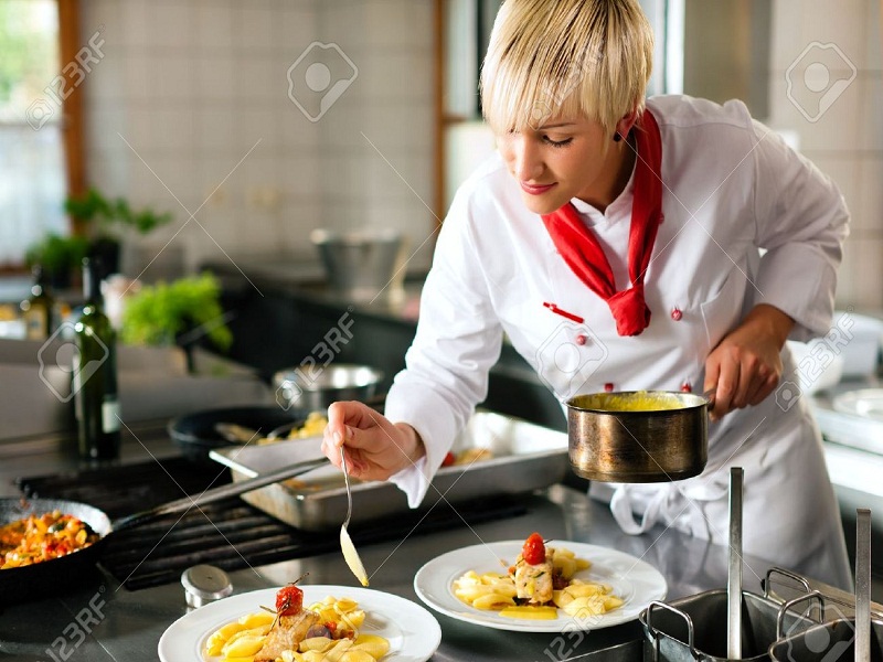 10448844-Female-chef-in-a-restaurant-or-hotel-kitchen-cooking-delicious-food-she-is-decorating-the-dishes-Stock-Photo.jpg